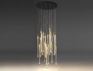 Glam Italian designer suspension light shown in a brass finish. Suspension light composed of plain and hammered plated central design, 20 inches of chain included and a polished white plastic light diffuser. Finishes available in brushed/burnished brass or satin/polished nickel. This collection offers timeless and unique fixtures for any ambiance in fine crystals, metallics, marbles and wood. Also available in other chandeliers, table lamp, floor lamp and wall lamp versions. Made in Italy.