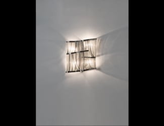 &lt;p&gt;Mono wall light shown in white Carrara marble. Finishes available in aluminum and copper. Wall light features a Carrara marble face with a choice of copper or aluminum ring.  Playful light directed from underneath the surface of the element. Made in Italy.&lt;/p&gt;
