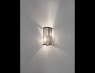 &lt;p&gt;Mono wall light shown in white Carrara marble. Finishes available in aluminum and copper. Wall light features a Carrara marble face with a choice of copper or aluminum ring.  Playful light directed from underneath the surface of the element. Made in Italy.&lt;/p&gt;
