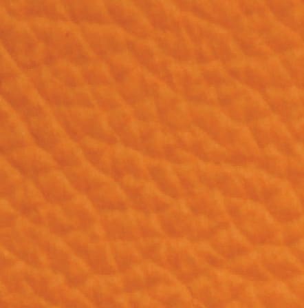 Orange textured leather surface close-up