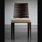 Wooden chair with slatted backrest and beige upholstered seat