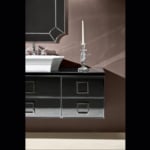 Wall-mounted mirrored bathroom vanity with square drawer handles and countertop sink