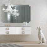 White wall-mounted bathroom vanity with gold handles and mirror