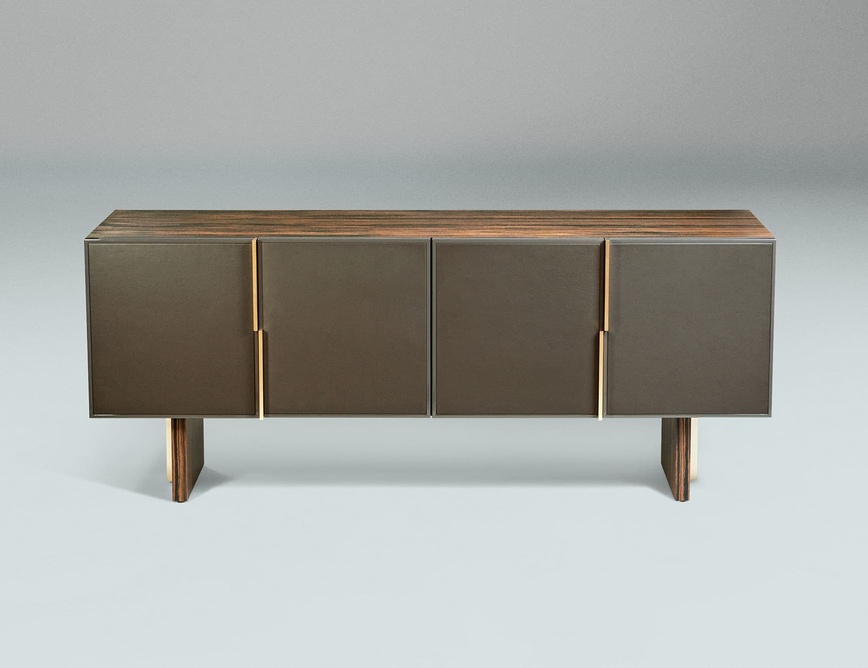 Milano 2 Italian designer sideboard shown in brown MDF with glossy monochrome lacquered polyester finish. Open compartment and drawers upholstered in leather. Legs composed of curved metal with brushed nickel finish with leather. Handles and details available in brushed nickel. This collection is distinguished by their enduring quality, embodying the timeless principles of originality, authenticity, and uniqueness that define the philosophy evident in every product, from singular pieces to complete projects. Milano collection offers a range of furniture pieces including stools, sofas, chest of drawers, coffee tables, beds, dining tables, dining chairs, and sofas. A wide selection of leathers are available to choose from (samples available upon request). Made in Italy.