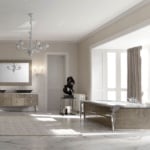 Freestanding rectangular bathtub with metallic frame and matching vanity in tiled bathroom