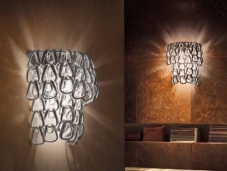 Romantic 165/AP3 Italian designer wall light shown in handmade crystal glass with Swarovski elements. Structure composed of polished chrome metal finish. Sizes available: 1 light, 2 lights, 3 lights (as shown), and 5 lights. Elements available: Swarovski Elements, teak and Spectra crystal. Finishes available: transparent with chrome and teak with iron grey. Collection made with the highest quality materials, showcasing its elegance and beauty. Made in Italy.Made in Italy.