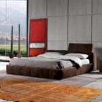Brown upholstered platform bed with fabric headboard in bedroom setting