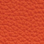 Orange textured leather surface close-up