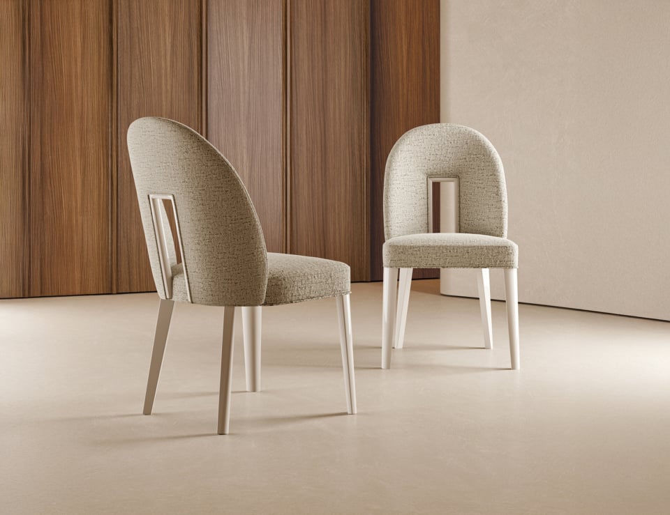 Fabric dining chairs in neutral setting.