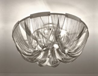 Sylar Designer Italian ceiling Light is shown in an oval shape made of five crystal mesh hanging drapes. Support structure composed of brushed stainless steel. Sylar creates a dramatic and romantic feeling by blending in with modern luxury. Available as a chandelier or a ceiling lamp upon request. Audio system available for integration with lamp. Made in Italy.