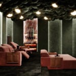 Kubrik fabric modular home theater sofa in a dark room setting