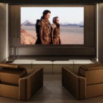 Kubrik fabric home theater furniture set in a wood-paneled room