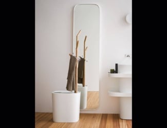 Entity Cono luxury Italian designer bathroom bench shown in Statuario Bianco marble on block. Stool, bathtub and washbasin versions also available. This collection features a high level of artistic, workmanship and craftsmanship. Elements used in the process include water, pressure, fire and experienced marble workers. Materials available in a wide range of marbles and stones. Dimensions, finishes and materials can be customized upon request. Made in Italy.
