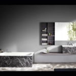 Rectangular marble bathtub in Grigio Carnico finish in bathroom setting