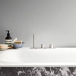 Marble bathtub with Grigio Carnico finish in bathroom setting