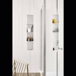 Glass shower enclosure in tiled bathroom
