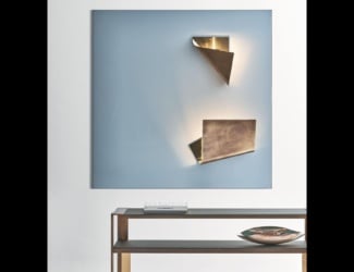 &lt;p&gt;Mono wall light shown in white Carrara marble. Finishes available in aluminum and copper. Wall light features a Carrara marble face with a choice of copper or aluminum ring.  Playful light directed from underneath the surface of the element. Made in Italy.&lt;/p&gt;
