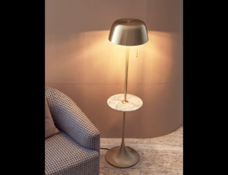 Fanus Italian floor lamp is shown in a fluted glass base with a amber colored Murano glass lampshade. The structure is composed of black metal with brass details and a glass base. The lampshade is available in fabric or amber colored Murano glass. A wide selection of fabrics are available to choose from (samples available upon request). Fanus collection is also available in a table lamp and suspension lamp versions. This collection is designed to illuminate space and provide the intimacy of shade. Made in Italy.