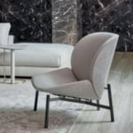 Leather lounge chair with metal legs in living room setting