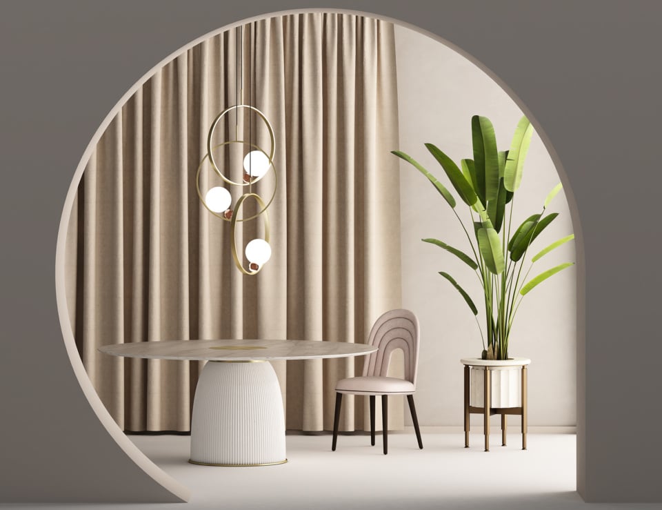 Fabric dining chair beside round table and plant