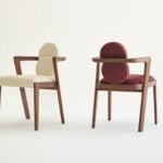 Fabric dining chairs with wooden frames, shown in beige and red upholstery.