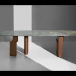 Quartzite dining table with Blue Roma finish and wooden legs