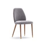 Fabric dining chair with wooden legs and brass tips