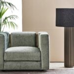 Leather swivel armchair with square design in living room setting