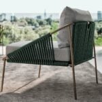 Fabric lounge chair with metal frame and rope detailing for outdoor seating