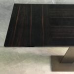 Wood console table with ebony finish and metal base