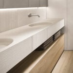 Marble bathroom vanity with Bianco Siberia finish and wooden base cabinet