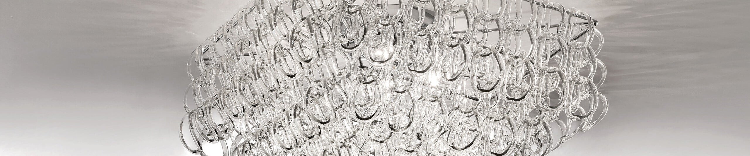 Ceiling chandelier with interlocking clear glass loops