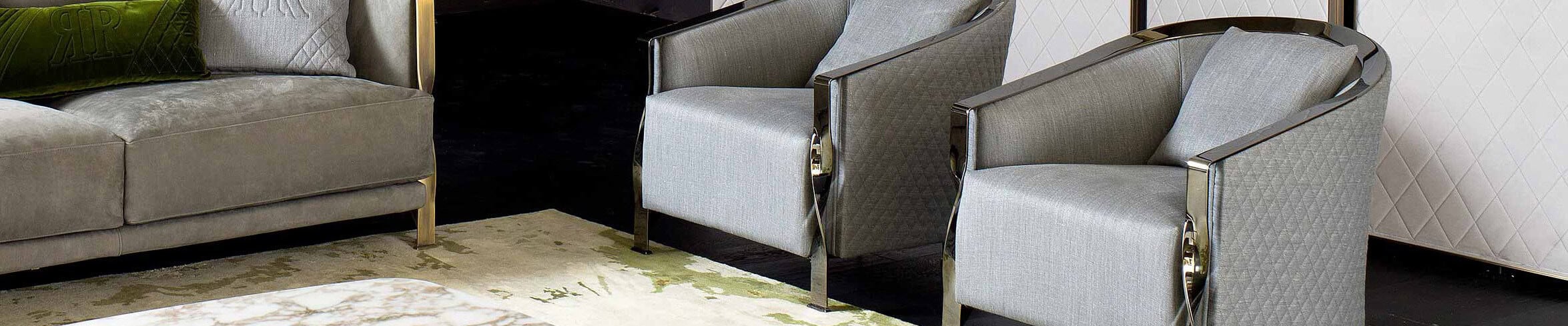 Gray fabric armchairs with metal frame beside matching sofa