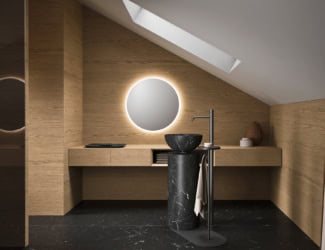 Caba 23.01 Italian designer bathroom composed of floor-standing washbasin with Half Flame Oak pedestal and Creta lacquered cement washbasin. Facet shown in satin stainless steel. Circular mirror shown with LED backlighting. Tall cabinets composed of Half Flame Oak with black stainless-steel handles. Sanitary ware shown in ceramic with matt white finish and stainless-steel flow taps. Caba collection inspired by Japanese comfort of nature’s shapes and beautifully designed in Rome. It is both visually and physically appealing. Made in Italy.