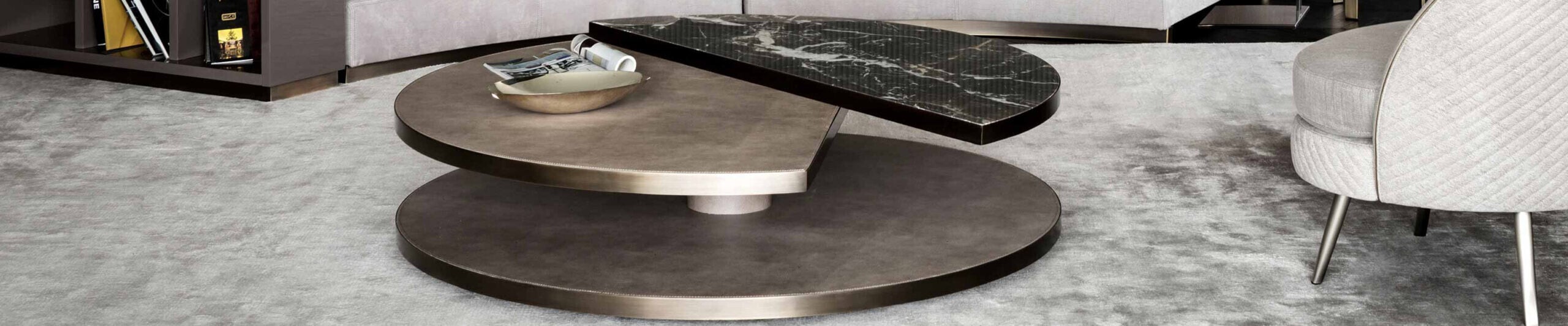 Round coffee table with layered metal base and marble top