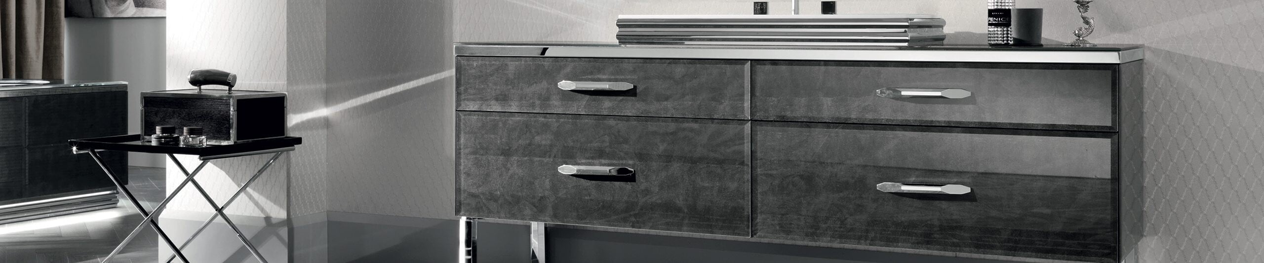 Wood and metal bathroom vanity with four drawers and countertop sink