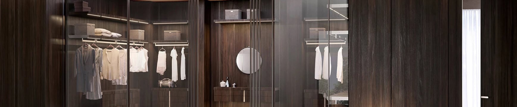 Wood wardrobe with glass doors and hanging clothes