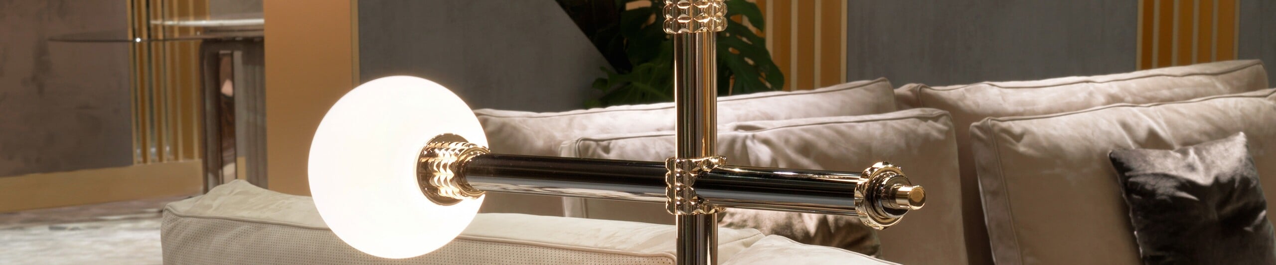 Metal table lamp with cylindrical base and round glass shade