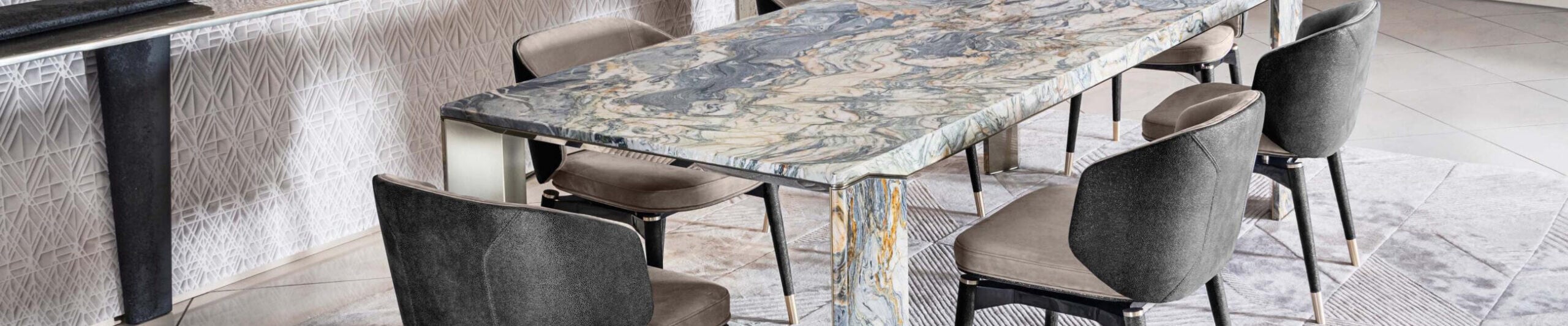 Rectangular marble dining table with upholstered chairs in dining area