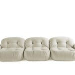 Fabric three-seater sofa with tufted cushions and rounded arms