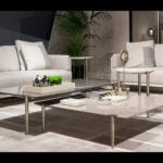 Lacquered wood coffee table with metal legs in a living room setting