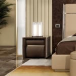 Leather bedside table with walnut finish and two drawers beside bed