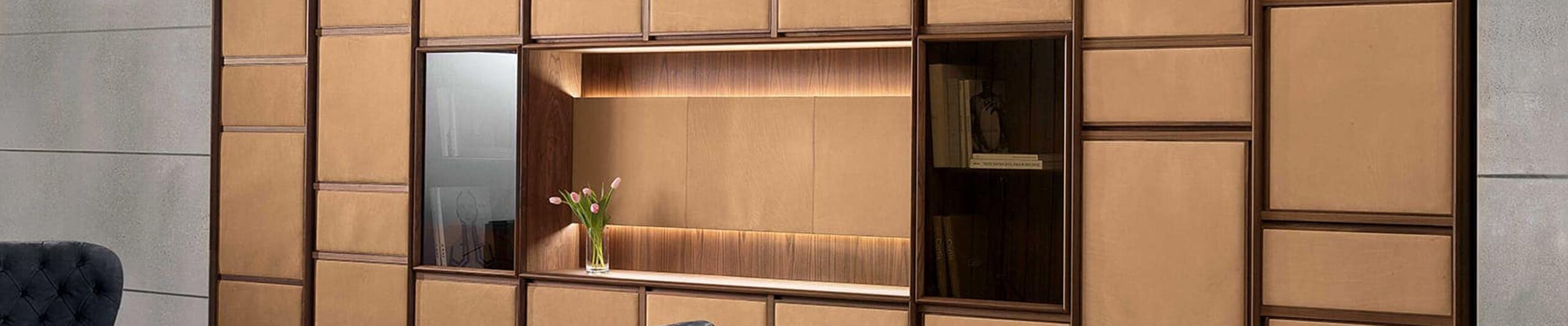 Leather and wood wall paneling with integrated shelving