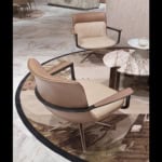 Upholstered leather office chair with metal base in seating area