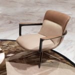 Upholstered leather office chair with metal frame and swivel base