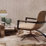 Upholstered leather office chair with metal base and armrests