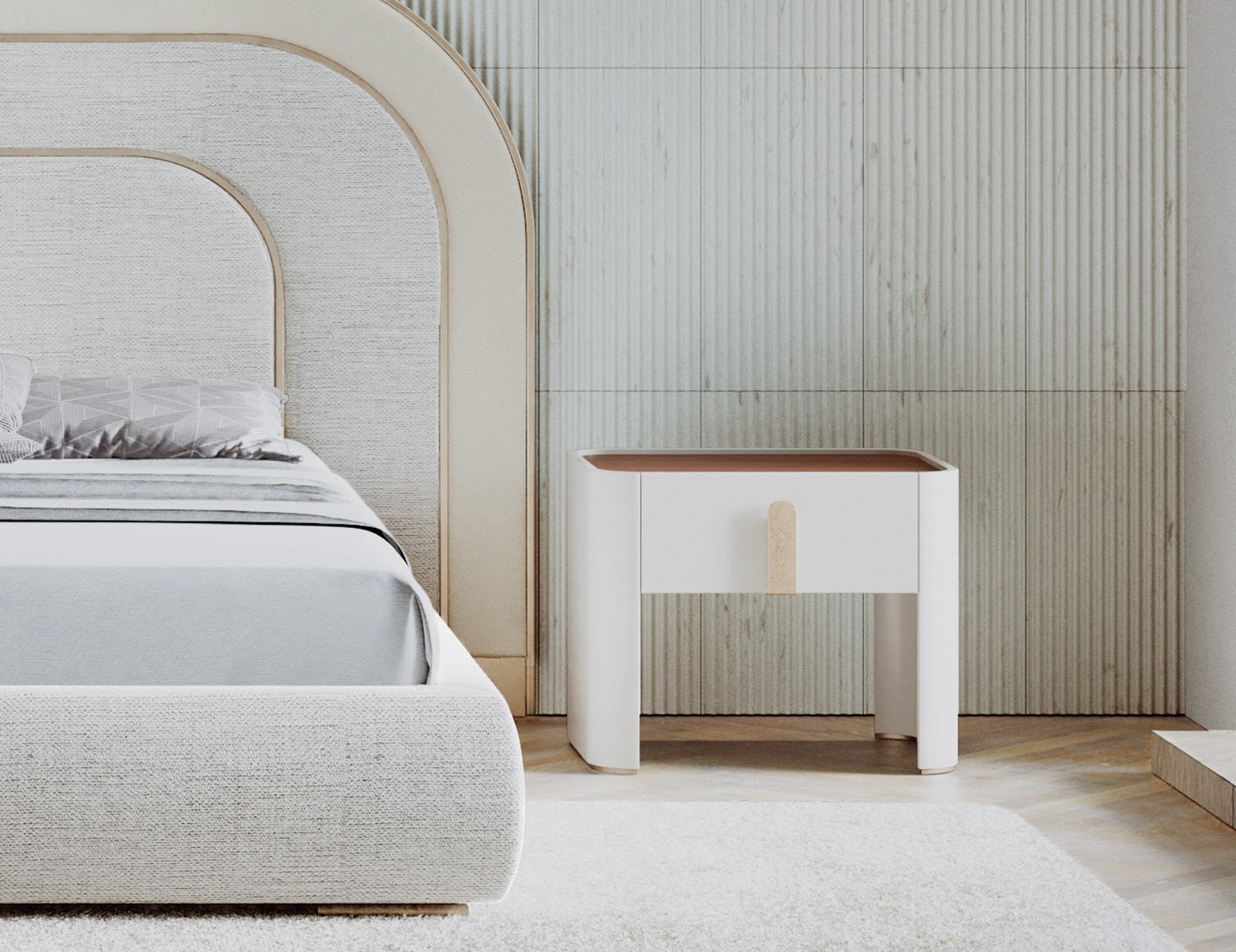 Wood bedside table with single drawer and rounded legs beside bed