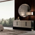 Leather chest of drawers with black handles in bedroom setting