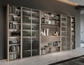 Flò 1 modern Italian TV unit is shown in clear glass with castors under the base. The structure is made of transparent or extra clear glass with castors under the base for practicality. The detailed crafting of the glass create supporting surfaces, making it ideal for the living area. Made in Italy.