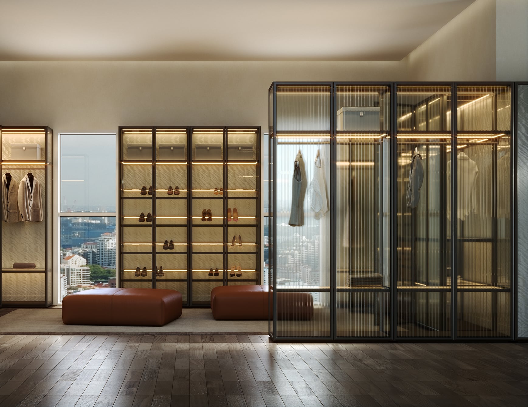 Glass and metal walk-in wardrobe with shelving and hanging space in bedroom setting